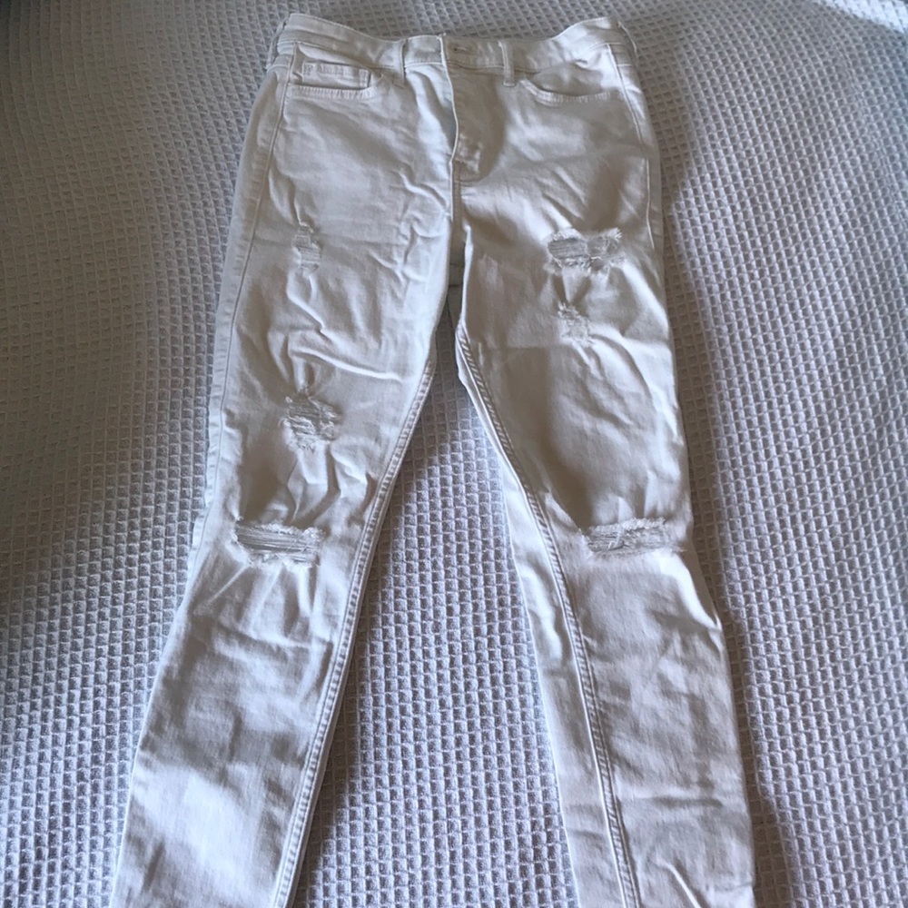 Full length white distressed skinny jeans